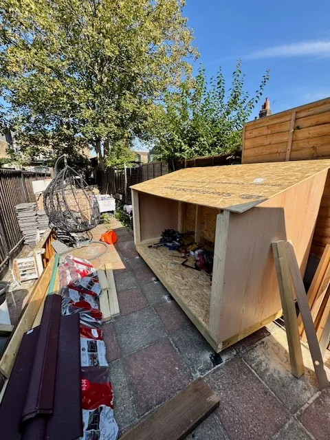 The workbench with the roof and back paneling installed, nearing completion.