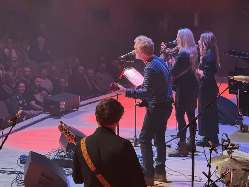 Glen singing a song with The Web Sisters. One is playing a small harp