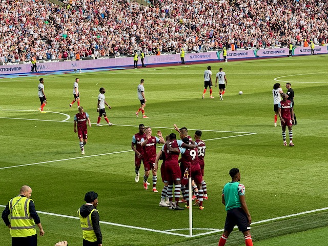 West Ham United players celebrating in the corner after scoring a goal