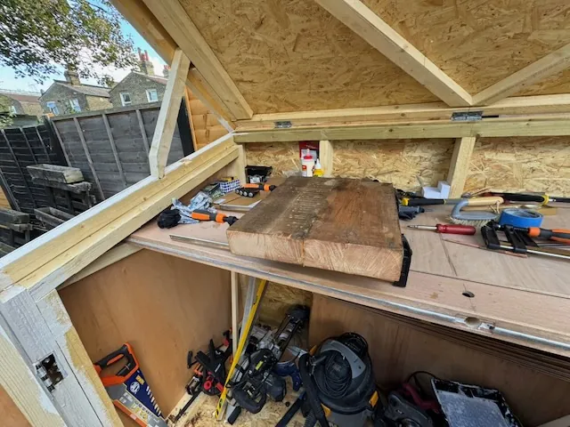 The glued-up guitar body clamped together and drying.