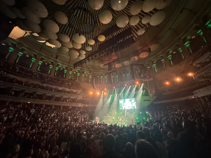 Wide shot of the hall lit with green and white light